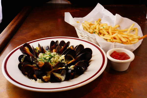 Shellfish in garlic and herbs with fries at La Creperie Cafe